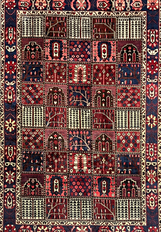 Midfield garden panels of 7x10 hand-knotted Persian Bakhtiari rug with cypress and floral compartments