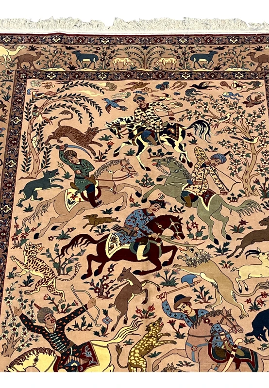 Upper field of 5x8 Persian Isfahan Seirafian hunting rug showing horsemen and leopard on blush