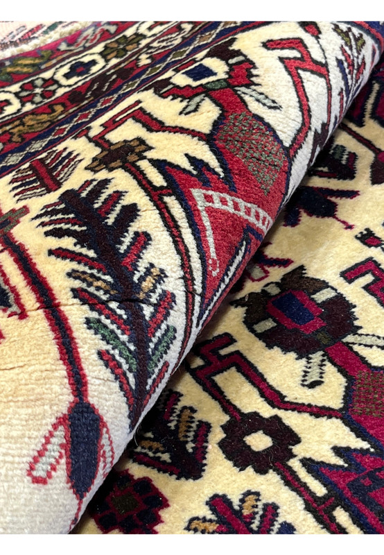 5x8 Persian Afshar tribal rug rolled showing thick 3/8 inch wool pile and cotton foundation