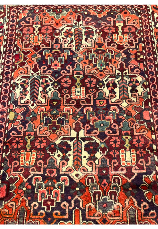 Allover floral pattern detail of antique 3'7"x5 Persian Bakhtiari rug in navy orange and ivory