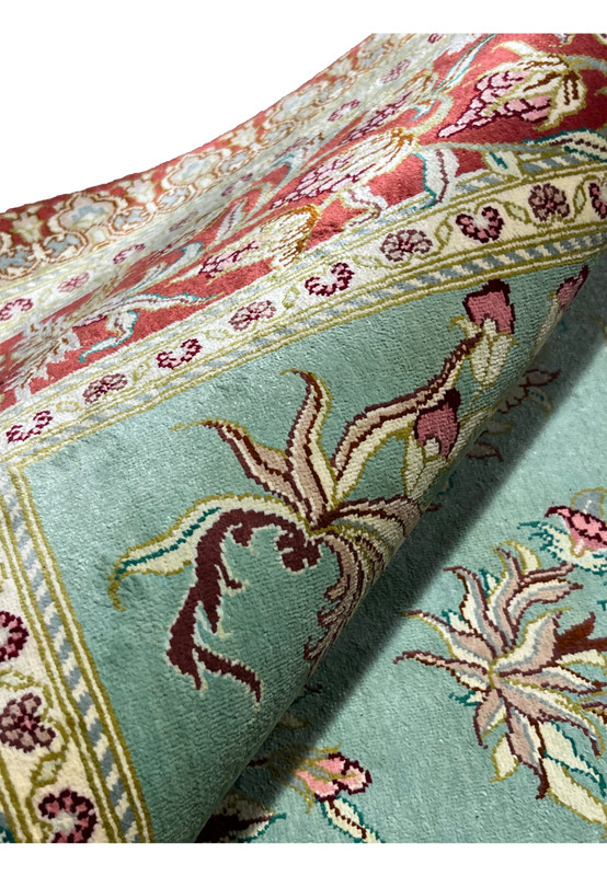 3x5 Persian Qum pure silk rug signed Motevasel silk pile texture rolled view celadon crimson border