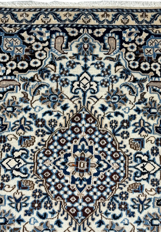 3x5 Persian Nain rug upper field ivory arabesque navy spandrel floral detail