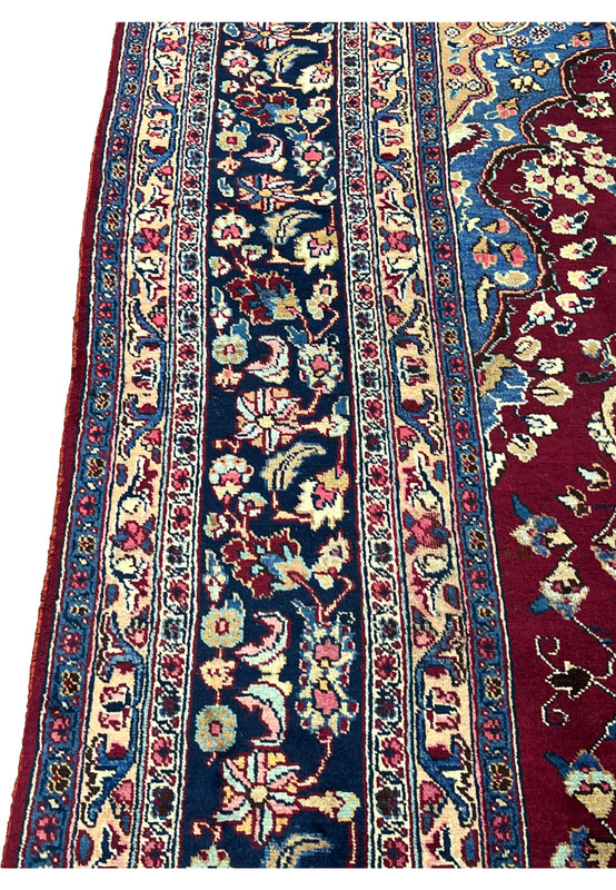 10x13 distressed antique Persian Mashad rug border closeup navy floral rosettes pink accents
