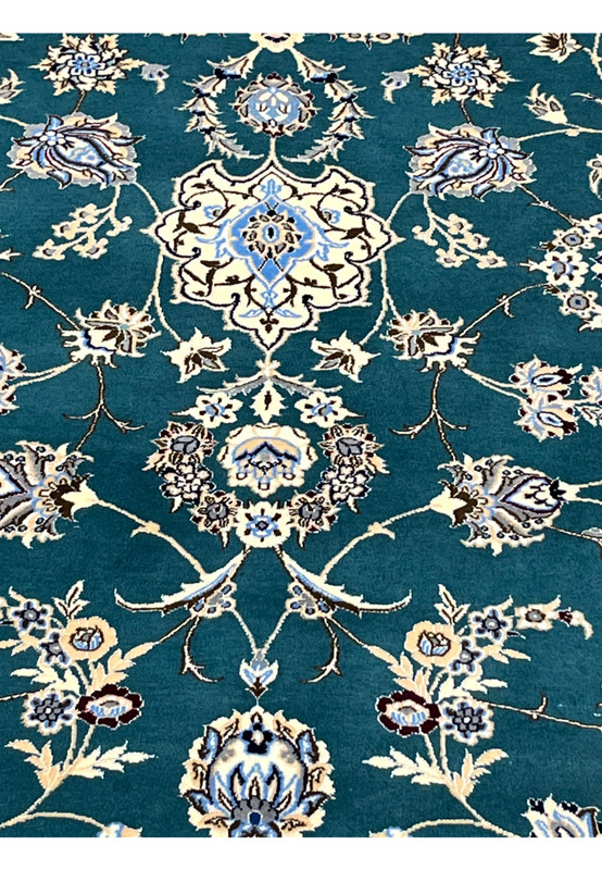 Classical Nain floral motifs including palmettes rosettes and arabesque vines in silk and wool
