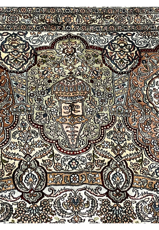 Detail of the floral vocabulary with rosettes palmettes and vine scrolls in pure silk pile