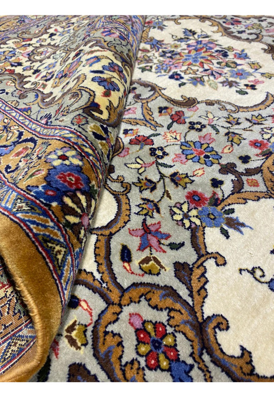 Rolled corner of this Qum Kork rug showing 0.36 inch pile and silky luster of throat lambswool