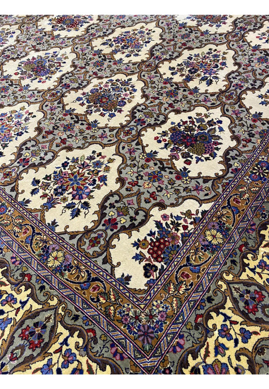 Angled view of this oversize 11x16 8 Persian Qum Kork rug for grand living room or formal dining