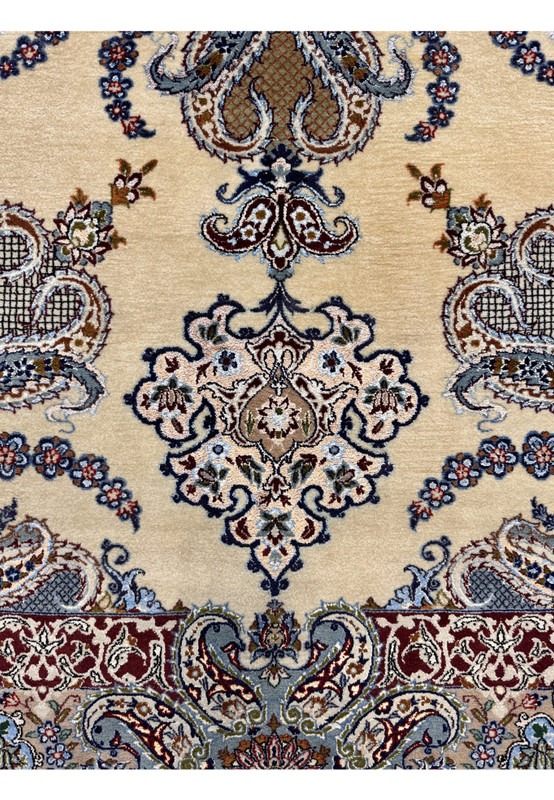Lower section of vintage Persian Isfahan rug showing pendant cartouche and curved paisley garlands