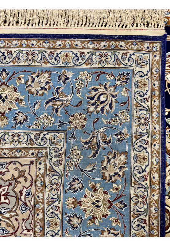 Backside of hand-knotted Persian Isfahan rug showing extreme tightness of approximately 700 KPSI knot structure