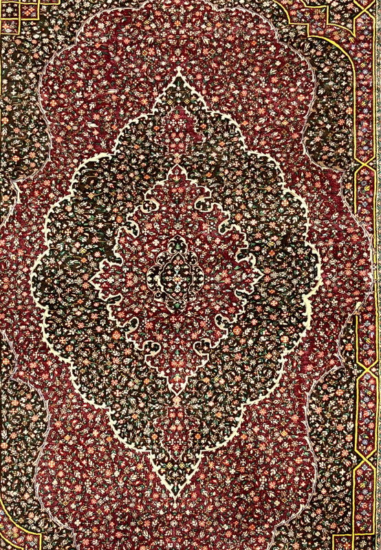 Closeup of the lobed ivory outlined medallion floating on densely scattered floral field