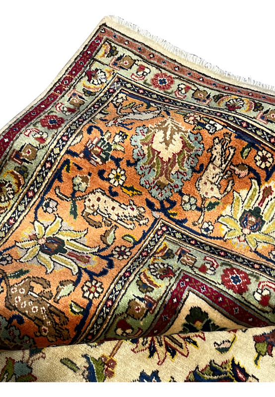 Backside fold showing the clean reverse and the high knot count typical of fine Tabriz workshop weaving