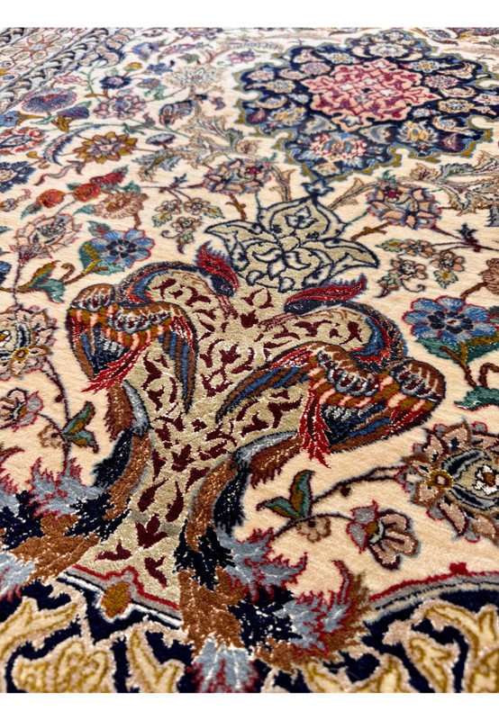 Hand-knotted Isfahan 4x6 with central medallion, prayer arch, paired peacocks, and pomegranate motifs on a cream ground