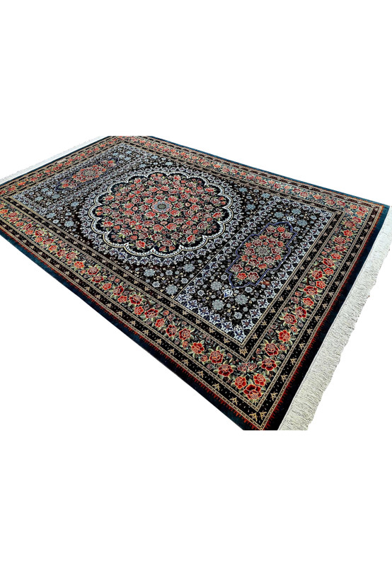 Angled studio view of signed Mohseni Qum pure silk rug highlighting jewel toned roses and silk sheen across the pile