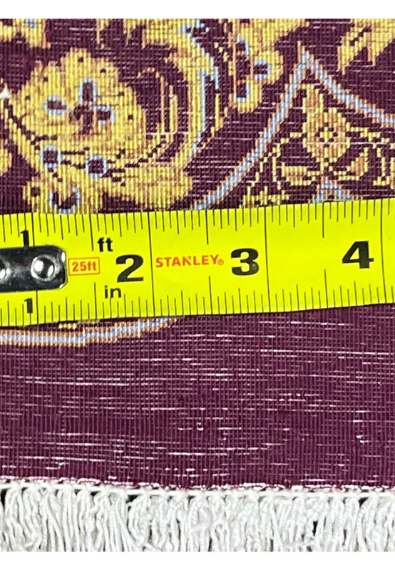 Backside knot density measurement showing approximately 900 KPSI on signed Naimi Persian Qum pure silk rug