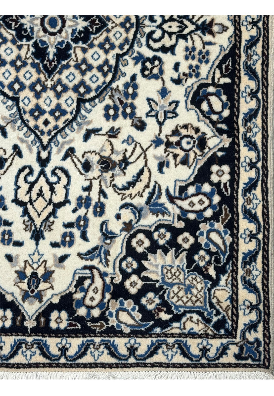 Right border view of 3x5 Persian Nain rug, dark navy main border with linked flowers and ivory vine guard