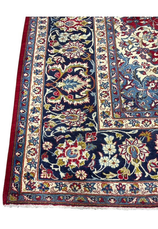 Border detail of authentic Persian Najafabad, navy main border with ivory palmettes and red rosettes, hand-knotted