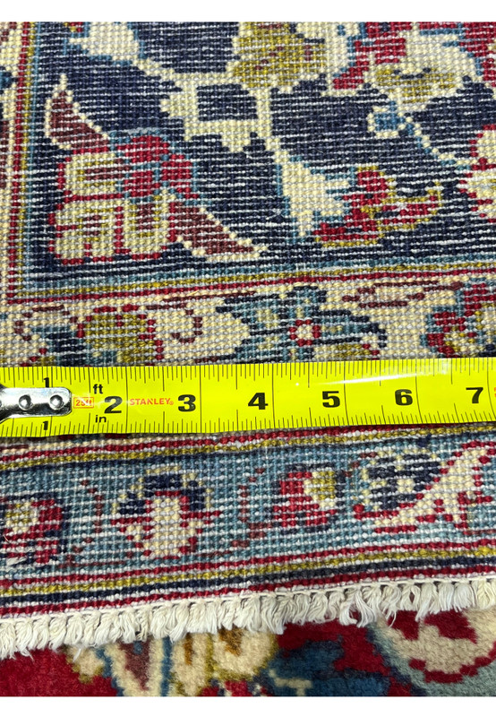 Backside knot density measured on Persian Najafabad, ruler showing tight knot count, 200 to 220 KPSI hand-knotted wool