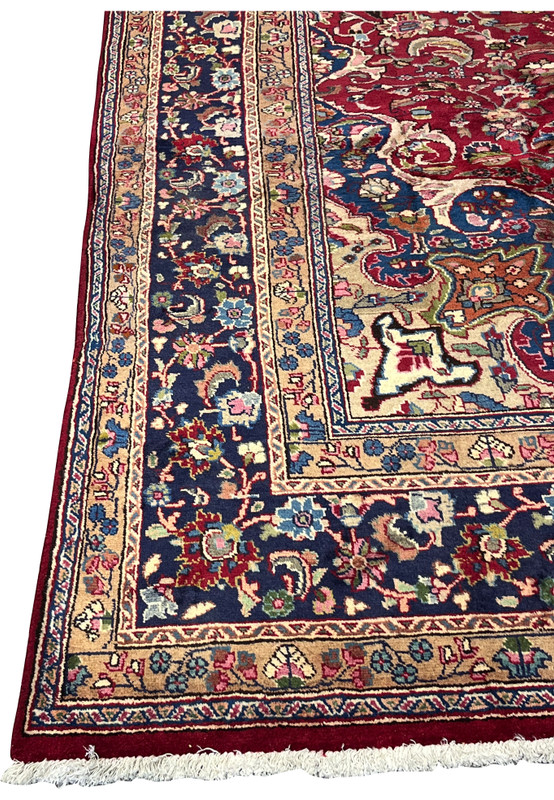 Corner spandrel of 10x13 Mashad rug, navy ground with salmon and caramel cartouches, navy main border, handmade