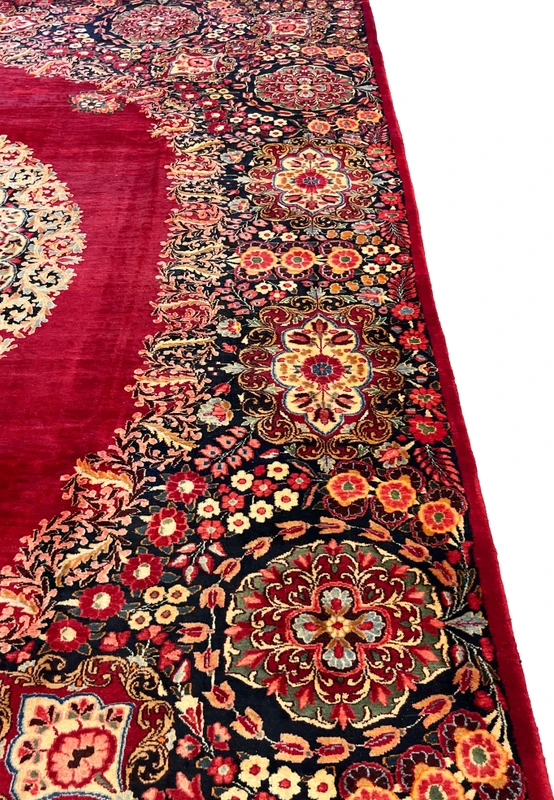 Side border of antique Persian Moud rug, dense floral rosettes in red and salmon on navy ground, fine workshop drawing