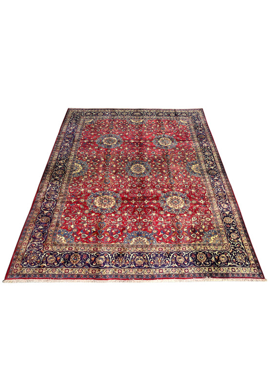 10x13 Persian Isfahan rug laid down, oversize hand-knotted wool on cotton, allover floral in red and navy for large dining room