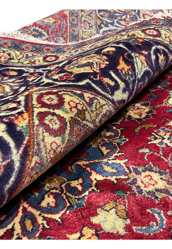 Rolled view Persian Isfahan rug showing pile depth and back, 220 KPSI hand-knotted wool on cotton, never used oversize workshop weave