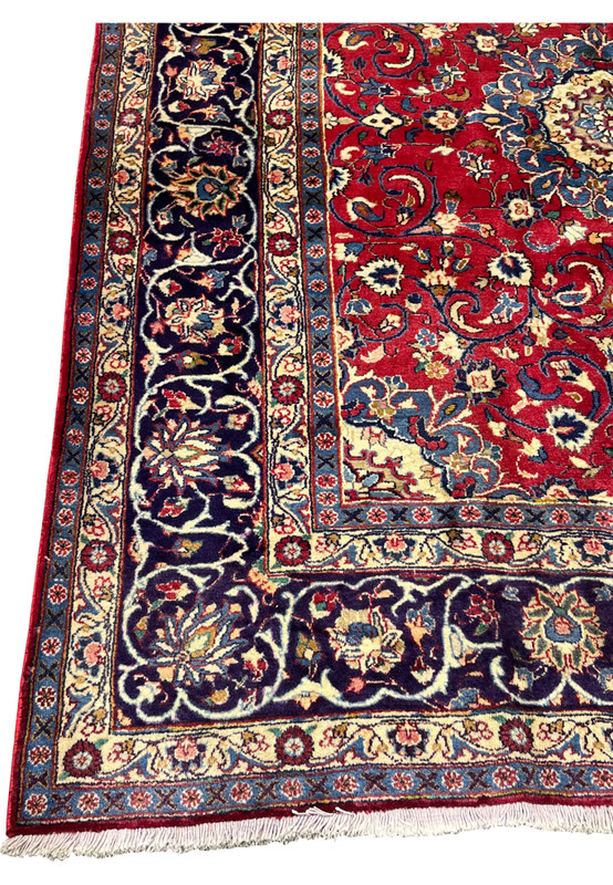 Navy main border of Persian Isfahan rug, ivory palmettes and vase motifs on indigo ground, fine 220 KPSI hand-knotted wool