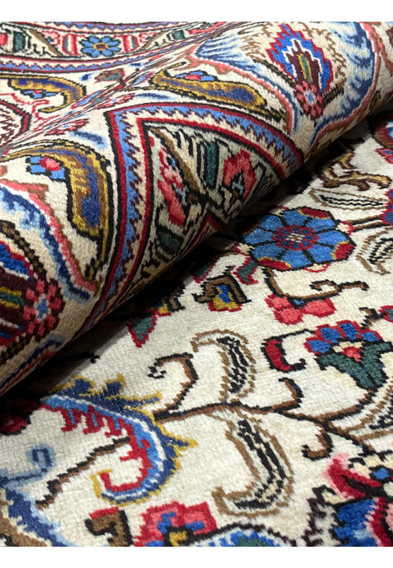 Rolled view Persian Tabriz rug showing pile depth and back, 240 to 260 KPSI hand-knotted wool on cotton, never used