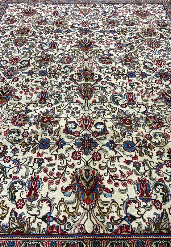 Midfield detail Persian Tabriz rug, dense scrolling vinework and palmettes on warm ivory ground, fine 240 KPSI hand-knotted