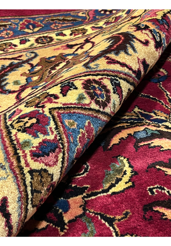 Rolled view Persian Mashad rug showing pile depth and back, 220 to 240 KPSI hand-knotted wool on cotton, signed Shash-Kalani
