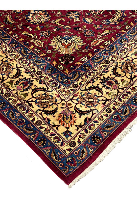Corner edge of 10x13 Persian Mashad rug, navy and gold guard borders meeting at corner, signed Shash-Kalani never used wool