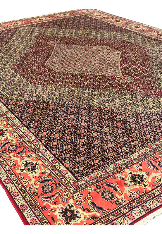 Angled view of 10x13 Persian Senneh rug, stepped diamond medallion with fine herati field, hand-knotted for large dining room