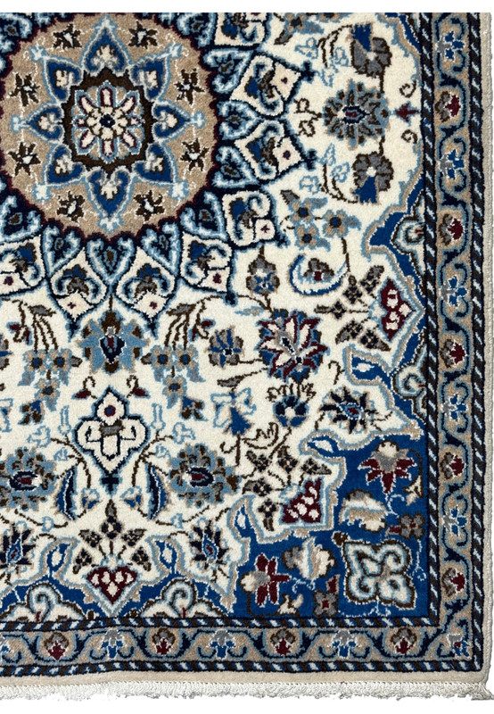 Royal blue main border of Persian Nain rug, paired floral cartouches in ivory and garnet for entryway use