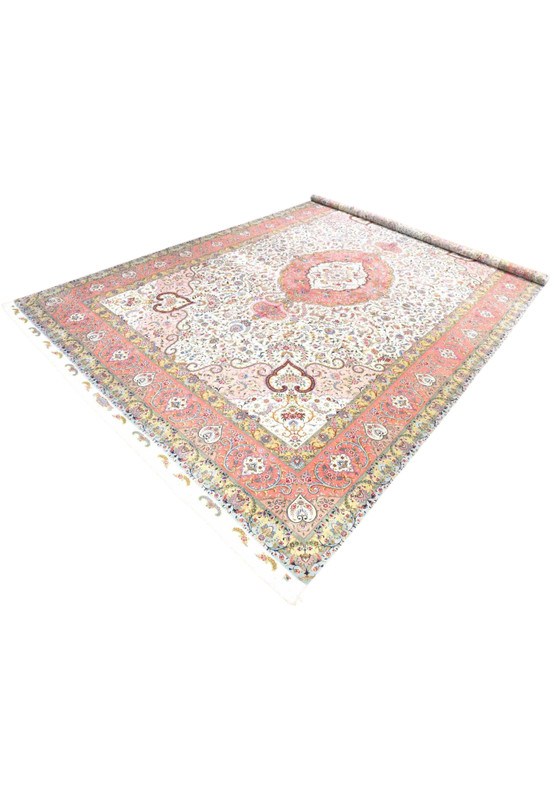 Angled view of mansion size Persian Tabriz wool and silk rug with luminous ivory field