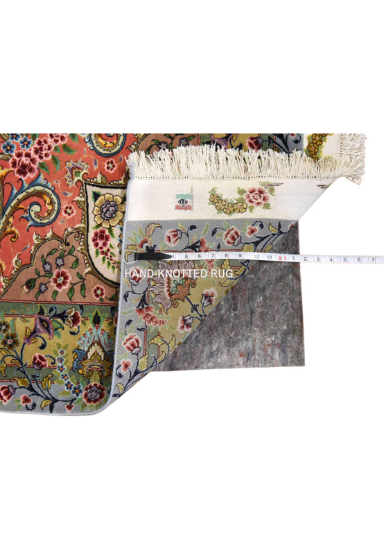 Backside of hand-knotted Persian Tabriz rug showing the fine silk foundation and dense weave