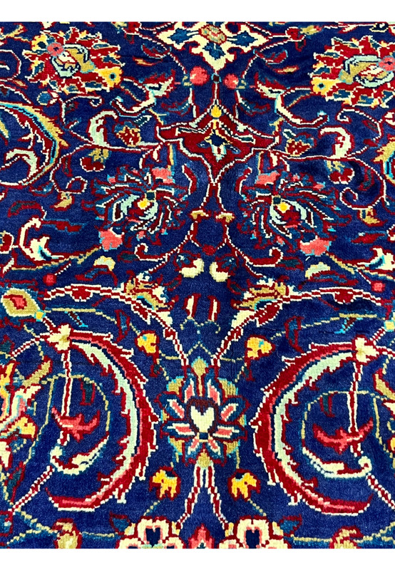 Pattern close-up of navy Mahal field, rotating floral palmettes for a living room or dining room