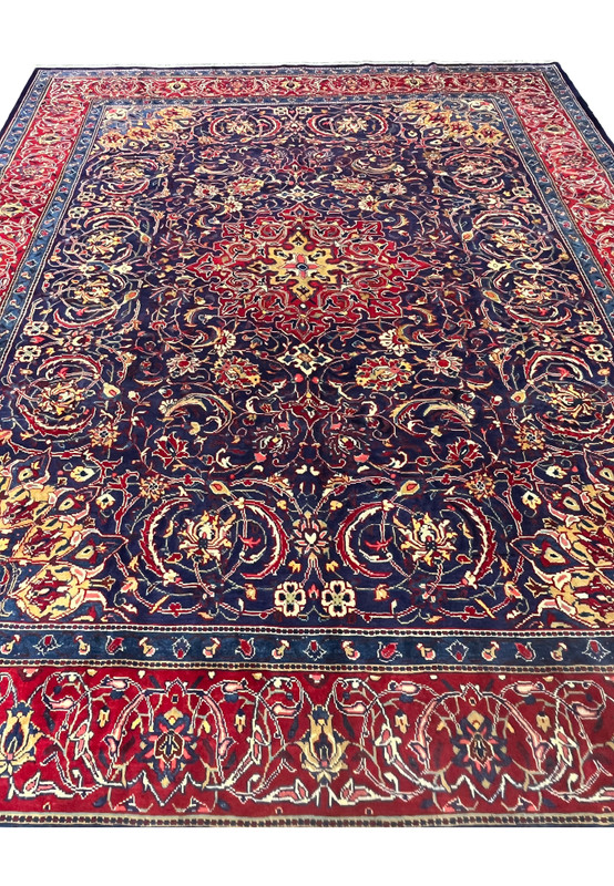 10x13 Persian Mahal rug, navy field with red border and allover floral design, hand-knotted wool
