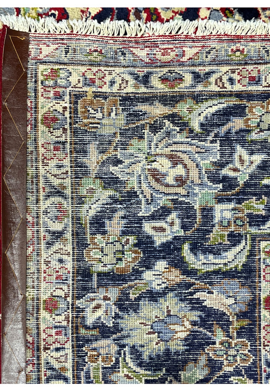 Reverse view of Persian Najafabad rug showing tight 180 to 200 KPSI hand-knotted weave on cotton foundation