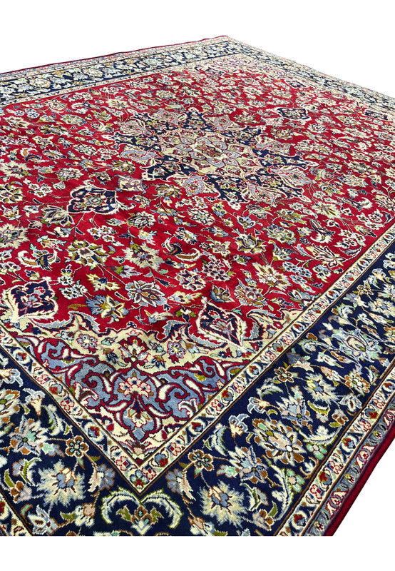 Angled detail of dense allover floral field and inner border, Persian Najafabad rug for traditional living room
