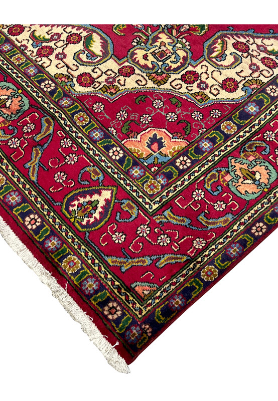 Corner spandrel detail with ivory ground and floral arabesque, hand-knotted Persian Tabriz rug border transition