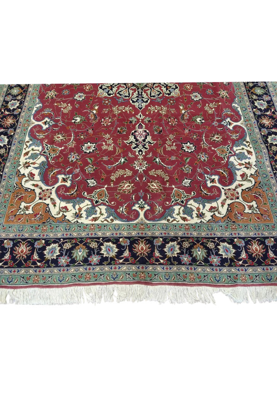 Lower field and ivory spandrel of Persian Tabriz 60 raj wool and silk rug, finely drawn floral lattice on red ground