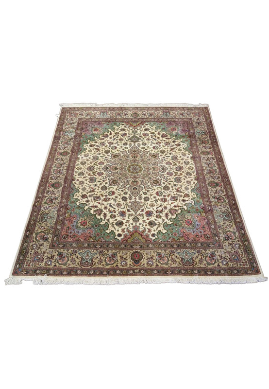 Full overhead view of Persian Tabriz 50 raj wool and silk rug, ivory field with salmon and coral spandrel accents