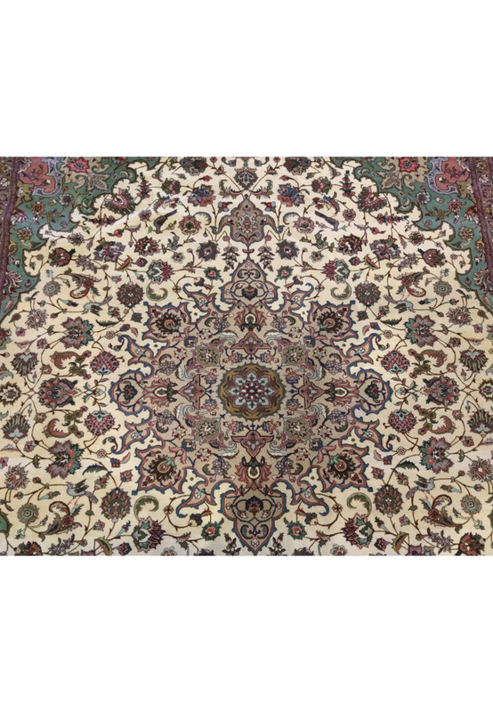 Delicate central rosette medallion of Persian Tabriz 50 raj rug, small floating motif in dense floral field