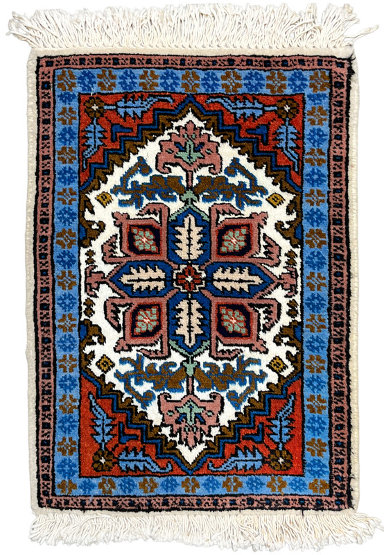 Full overhead view of 1'3 x 2 Persian Ardebil rug, stepped geometric medallion on ivory with rust and sky blue