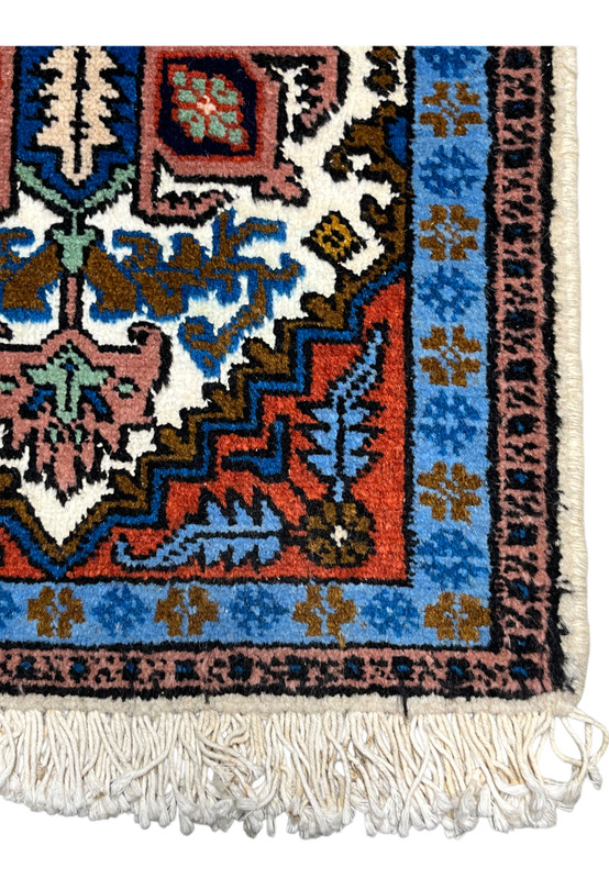 Border closeup of Persian Ardebil baby rug, sky blue main border with dusty rose guard band and geometric repeats