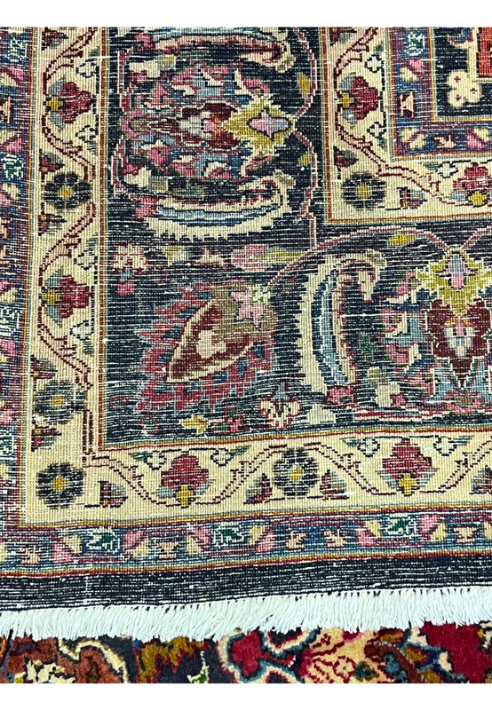 Reverse of the Persian Mashad displaying the dense even knotting across the borders