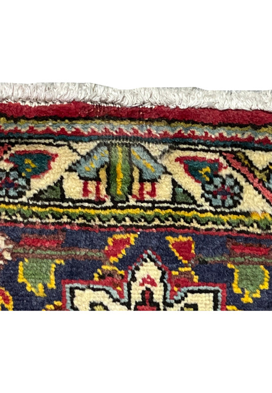 Low pile area on the Tabriz showing gentle wear consistent with a forty year old handmade rug