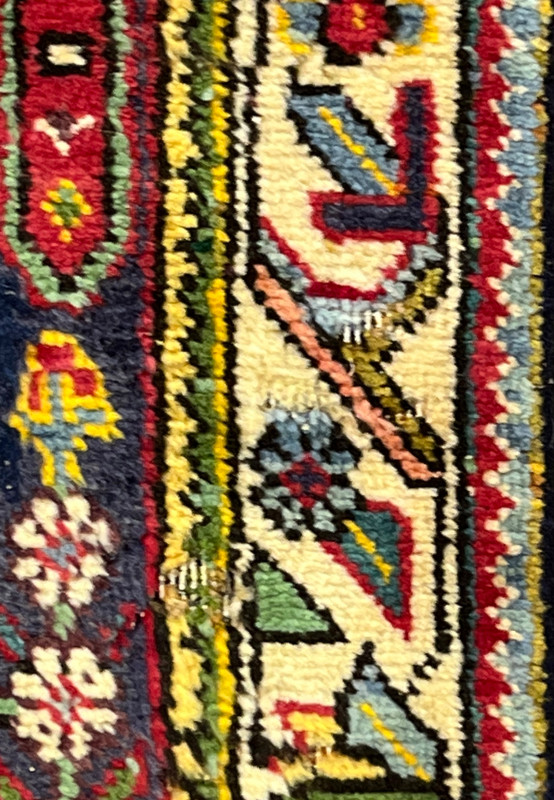 Detail of worn and low pile spots with natural abrash, marks of an authentic vintage Tabriz