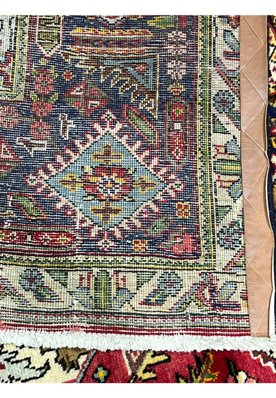 Backside of the Tabriz showing fine even hand-knotting, clear pattern, and cotton foundation