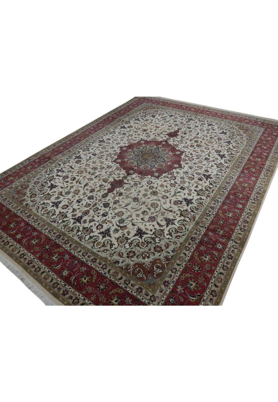 Angled view of the 10x13 Tabriz 60 Raj rug showing its ivory field and rose-red floral border