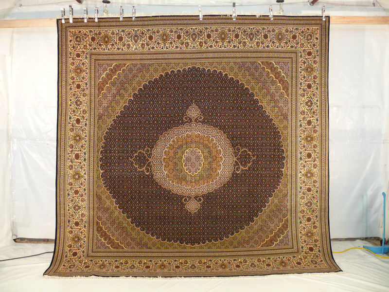 The intricate Mahi fish design of our 10x10 Persian Tabriz Rug expertly woven into high-quality wool and silk materials